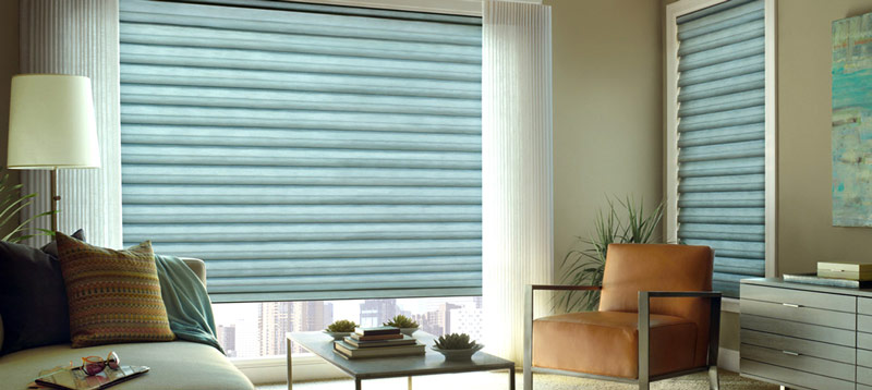 A photo of Hunter Douglas Solera model, an example of custom Roman Shades that help block out excessive sunlight.